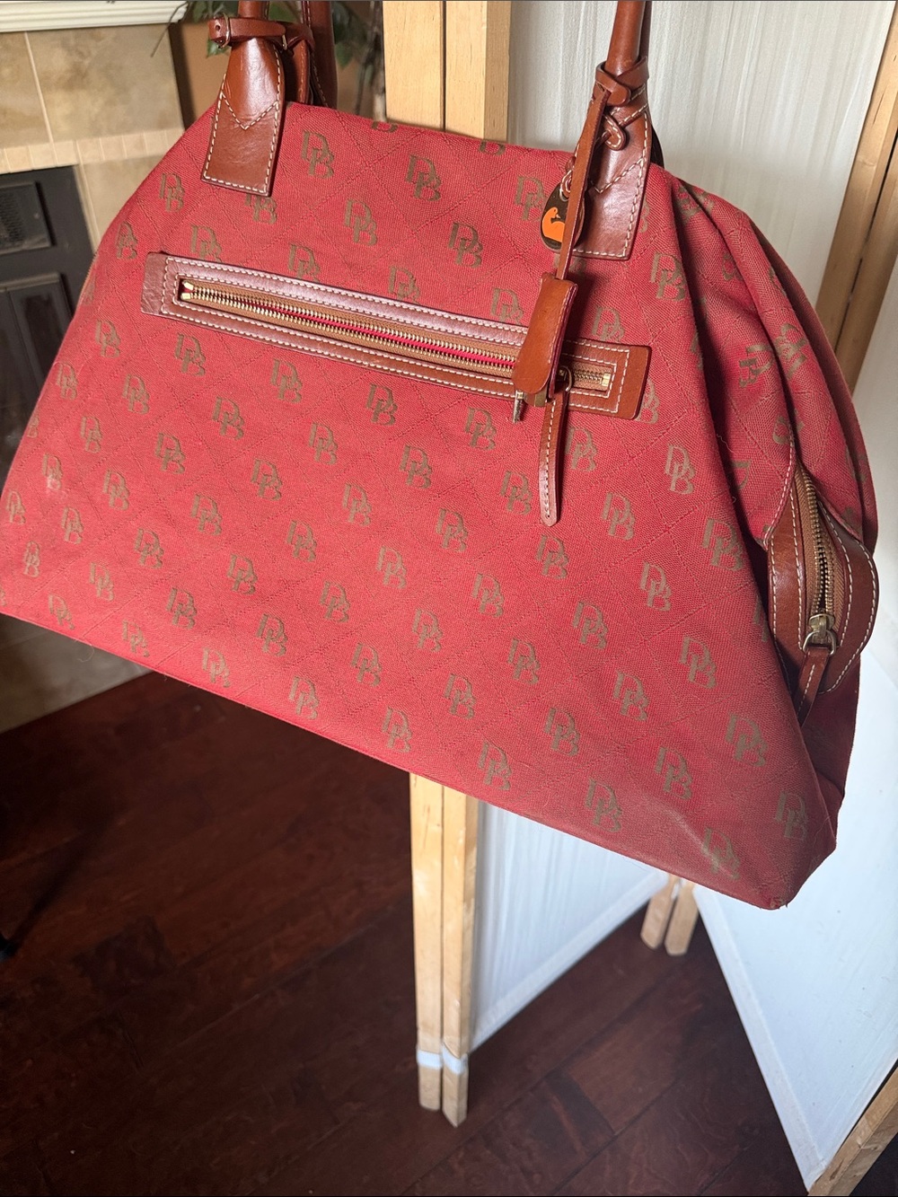 Classic Dooney and Bourke logo weekender bag with lock and key.